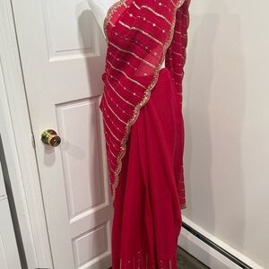 Elegant Red Saree with Gold Accents